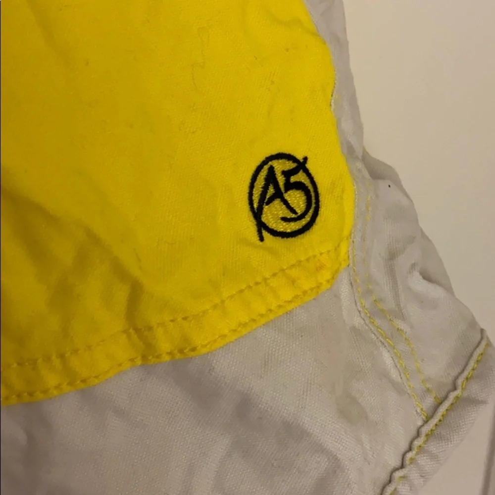 The north face men’s yellow swimming trunks